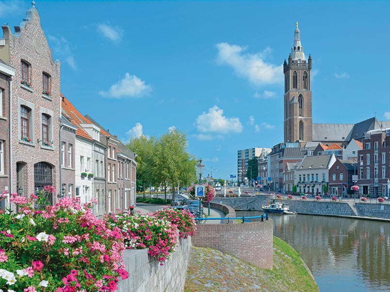 A canal in Roermond lined with flowers, Netherlands